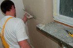 Naniesienie zaprawy pacą zębatą na całą powierzchnię ściany YTONG_MULTIPOR_8.jpg